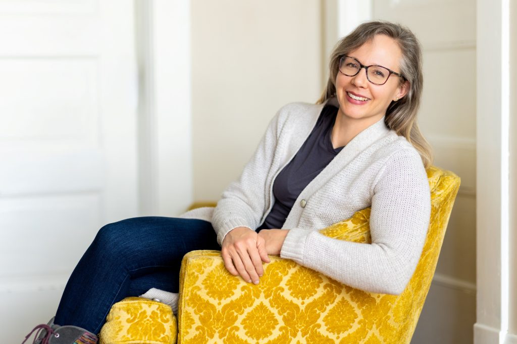 Faith Lauterbach betrayal recovery, nutrition, and holistic life coach seated Lincoln Nebraska
